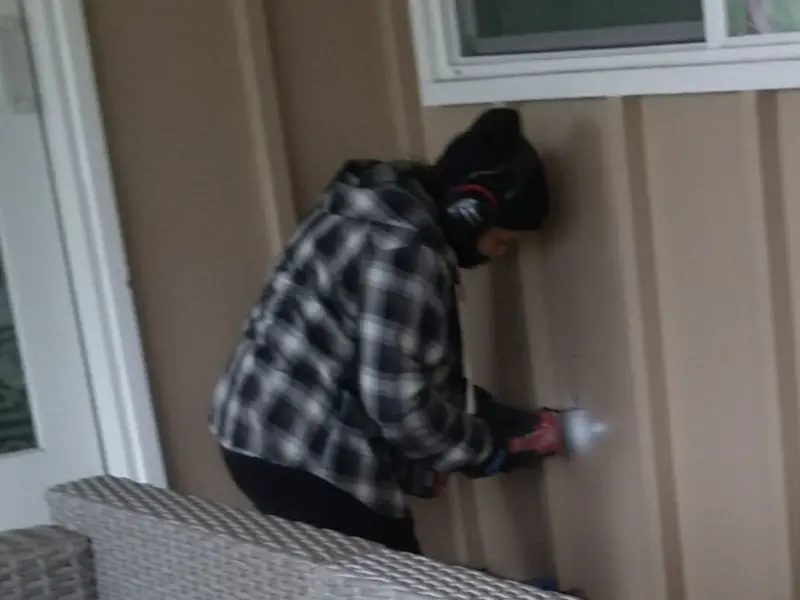 Professional electrician installing an exterior outlet in Fort Thomas